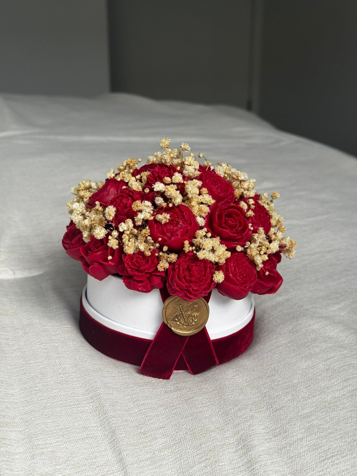 Petite Fleur mini wax bouquet of red peonies and roses in a small white box with a velvet ribbon and gold seal